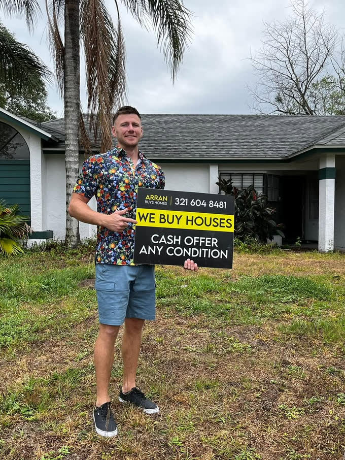 Arran outside a Central Florida property he bought for cash